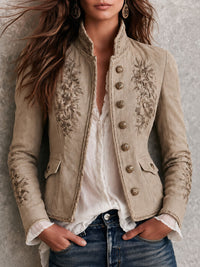 Veste rétro beige à col montant avec broderie florale et garniture tressée