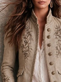 Veste rétro beige à col montant avec broderie florale et garniture tressée